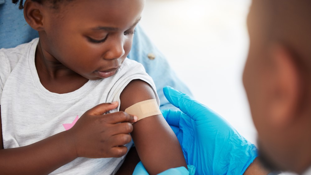 child getting a vaccine child getting a vaccine